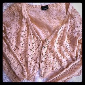 Light pink sweater.